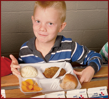 Fifth Grader with school lunch